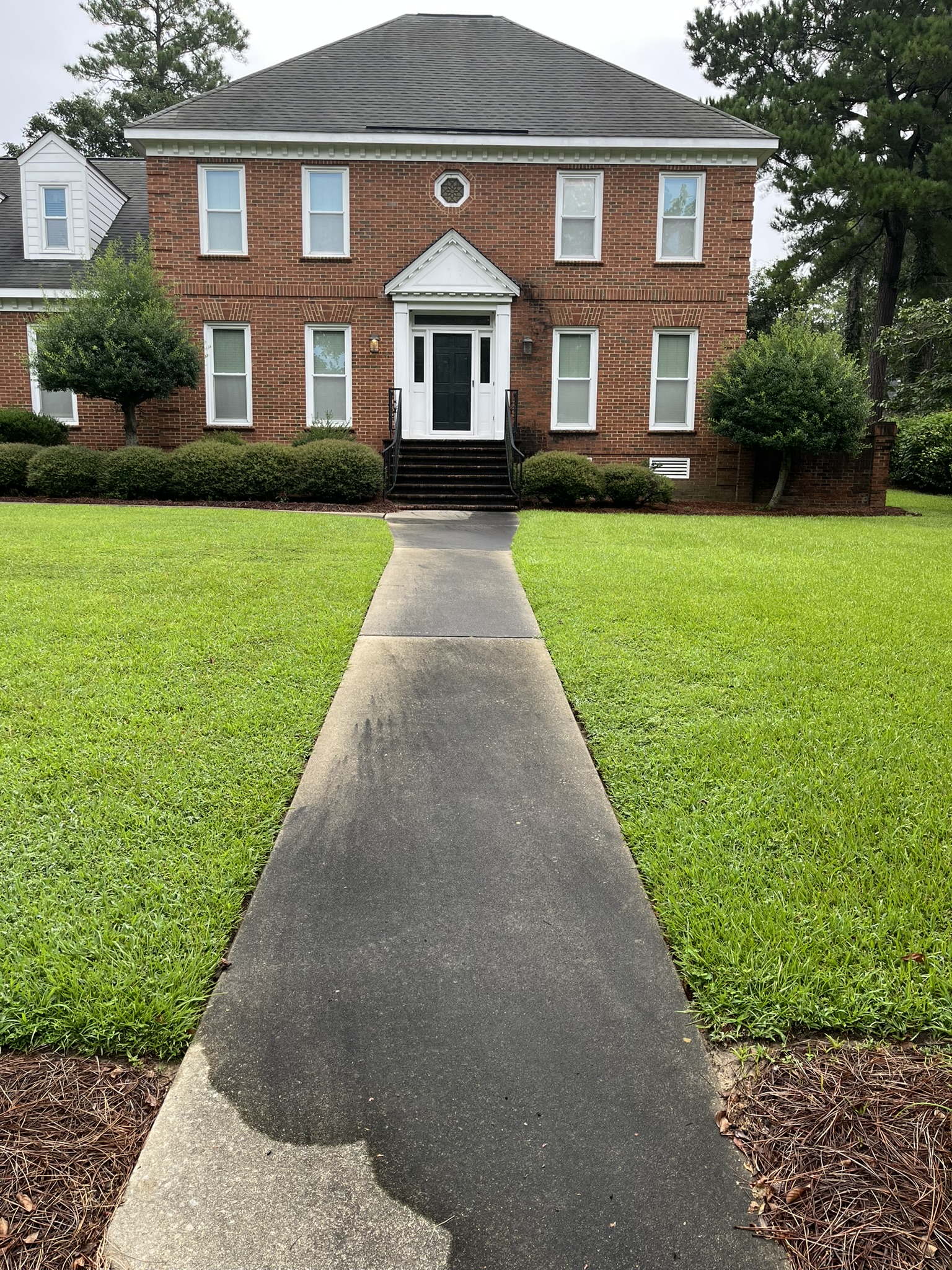 Sidewalk before pressure washing
